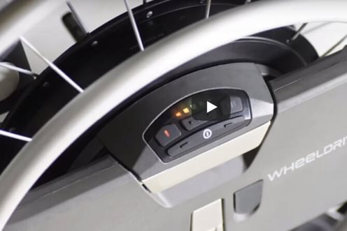 WheelDrive power assist for wheelchairs. Go further.
